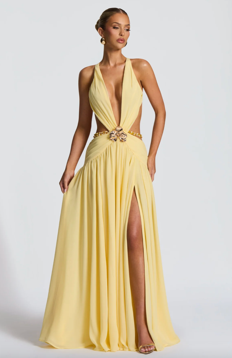 Robe longue avec fente et fleur métallique