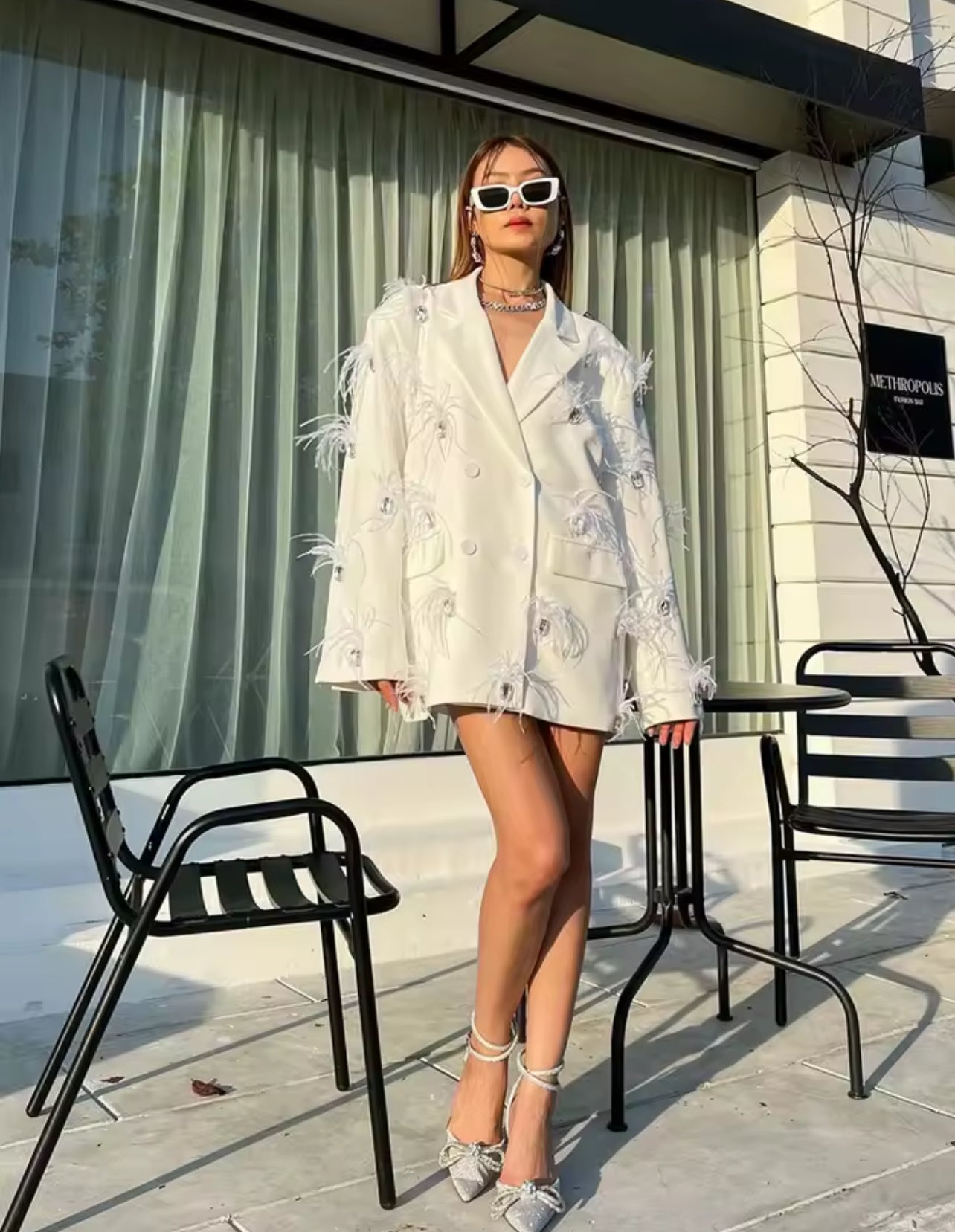 Blazer élégant avec cristaux et plumes